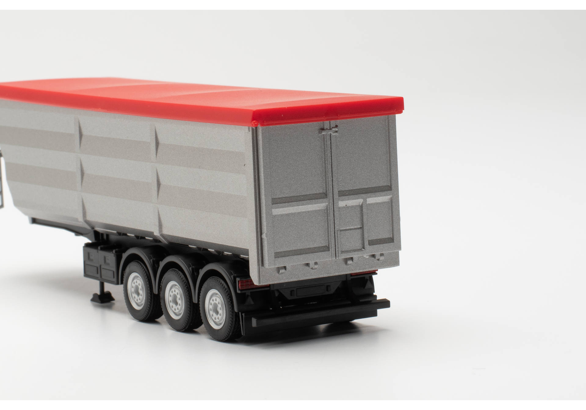 Steel dump trailer, silver with red tarp