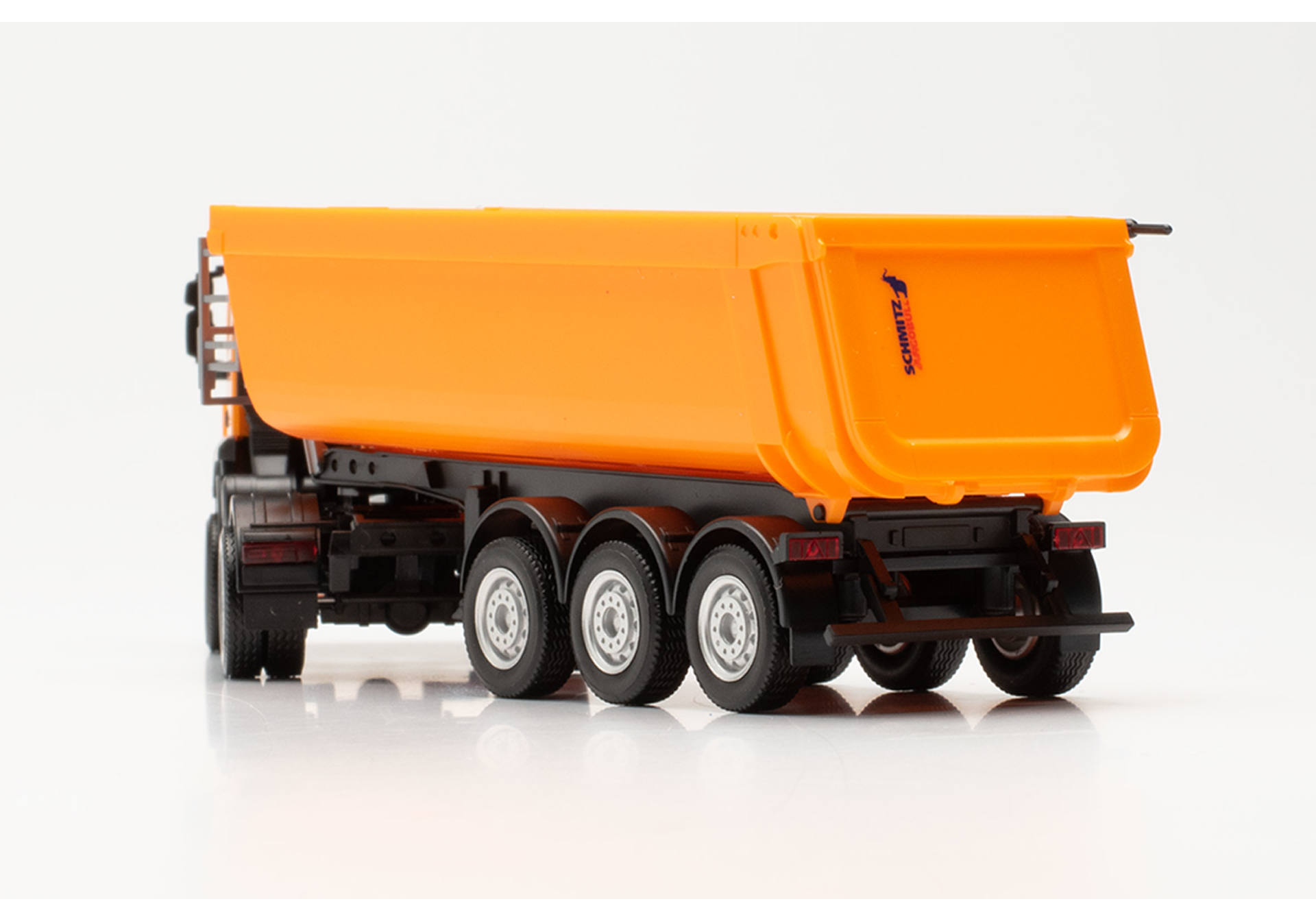 Iveco Trakker Schmitz Cargobull tipper semitrailer truck with steel body, municipal orange
